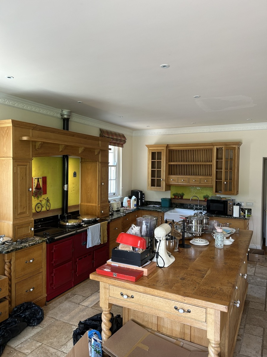 Kitchen items and appliances being prepared for professional packing before a home removal