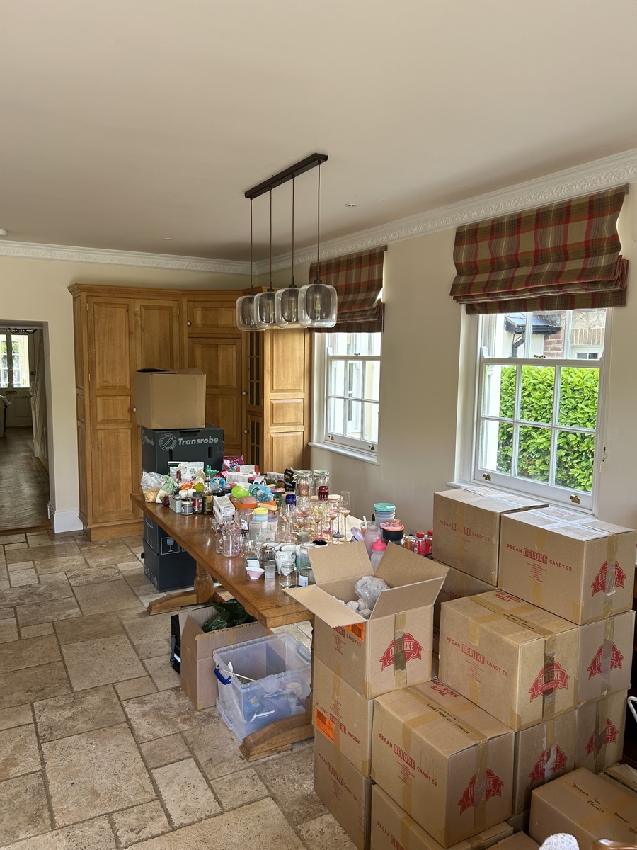 Belongings being sorted and unpacked into boxes during a professional packing service in Devon